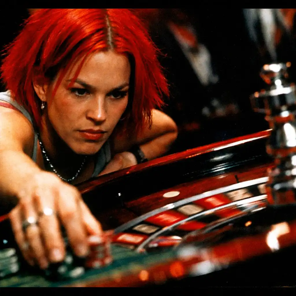 Franka Potente as Lola placing a bet at a roulette table in Run Lola Run